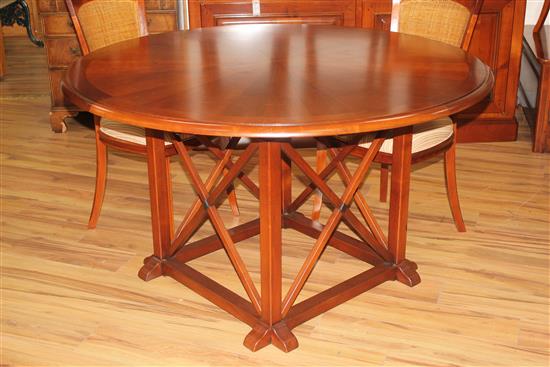 A 20th century French cherrywood radially extending dining table, the circular table extends to 6ft 7in.